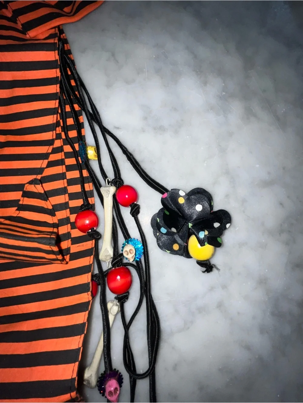 Orange and Black Striped Bow Belt Accent with Decorative Skull